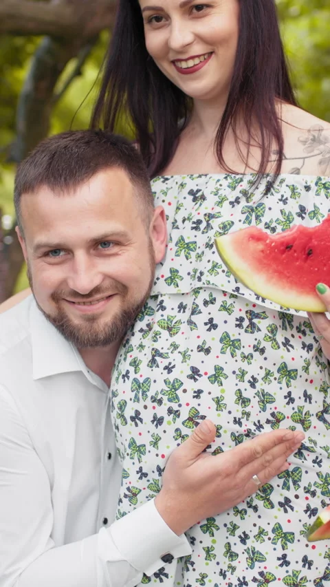 Couple Expecting with Watermelon. Vertical video. Stock Footage 316775705