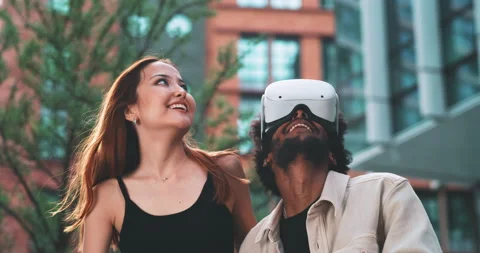 A couple experimenting with vr headset in the business district Stock Footage 201672170