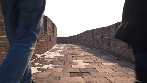 Couple explore Great Wall of China together, low camera on stone pavement of Video stock 124255019