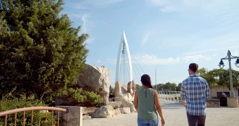 Couple Exploring the Keeper of the Plains Bridge in Wichita Stock Footage 115042583
