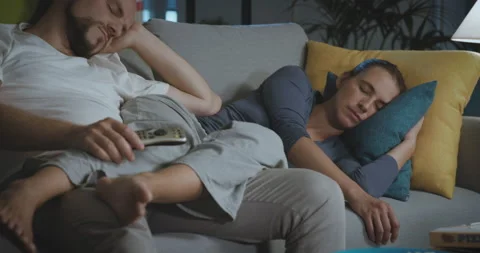 Couple falling asleep with TV on Stock Footage 162403964