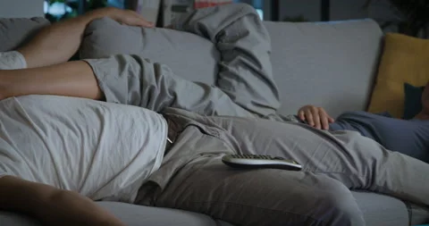 Couple falling asleep with TV on Stock Footage 162404296