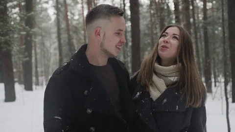 Couple is falling in Snowdrift in a winter forest Stock Footage 73039050