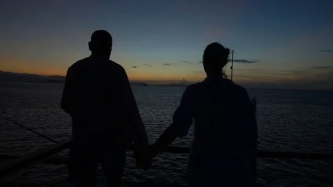Couple feel happy while admire the sunset, slow motion shot at 240fps, steadycam Stock-Footage 80416067