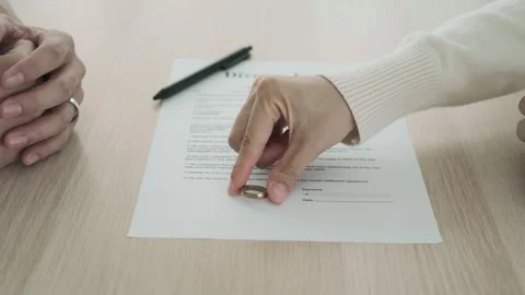 Couple is feeling stressed after agreeing to sign a divorce certificate. Conc Stock Footage 164664746
