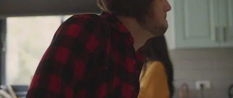 Couple feeling upset and hurt after having a big fight in the kitchen at home Stock Footage 132365729