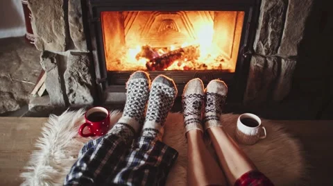Couple Feet in Woollen Socks by the Cozy Fireplace, 4K. Winter and Christmas Stock Footage