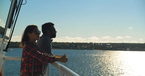 Couple on Ferry Balcony Deck at Sunset, Looking Out Over Ocean Stock Footage 102398592