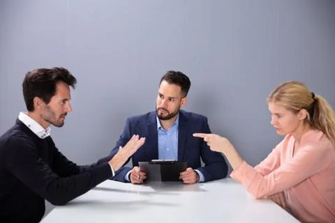 Couple Fighting In The Lawyer Office Stock Photos