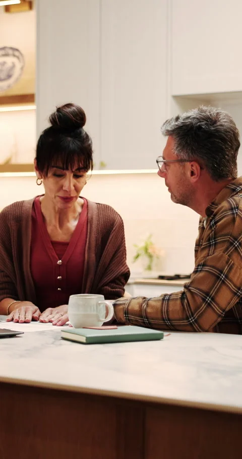 Couple, finance and documents with talk in kitchen for mortgage payments, bills Stock Footage 339161517