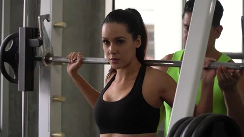 Couple fit exercise lifting barbells together in fitness gym . healthy with c Stock Footage 162807687