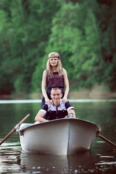 Couple floating on the boat Stock Photos
