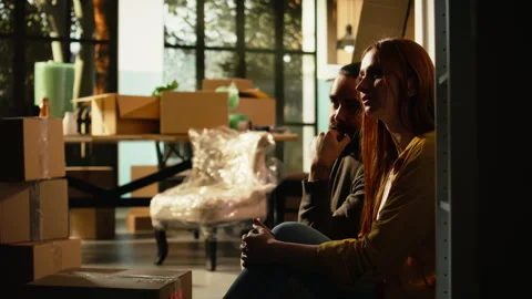Couple on the floor, break from relocation, moving in satisfaction, life event Stock Footage 342902285