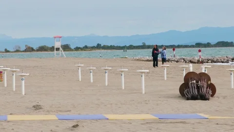 Couple Flying Kite on the empty winter Beach Stock Footage 117410192