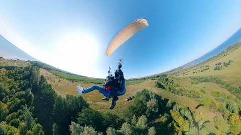 A couple is flying on the paraglider. Stock Footage 117895678