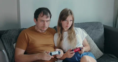 Couple focused video game playing couch Stock-Footage 305930714