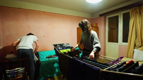 Couple Folding Laundry Together Stock Footage 145843058