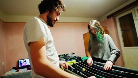 Couple Folding Laundry Together Stock Footage 145843377
