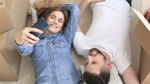 Couple fooling, during the relocation and making selfies. Stock Footage 88098435