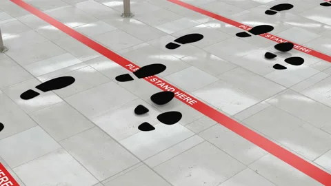 Couple of footsteps in the lineup at red queue line, keeping social distance Stock Footage 135085466