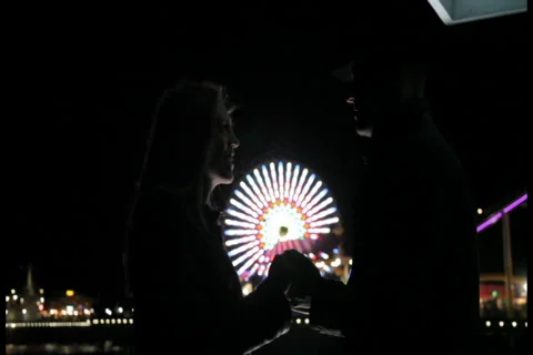 Couple in front of ferris wheel Video stock 36708055