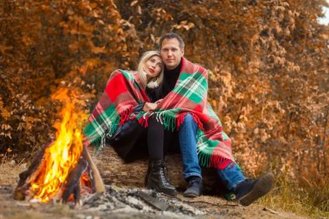 Couple in front of fire Stock Photos