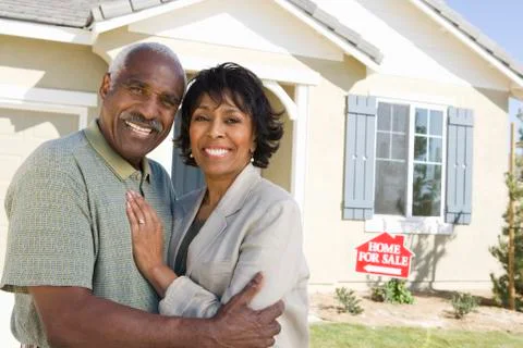 Couple In Front Of Home For Sale Stock Photos