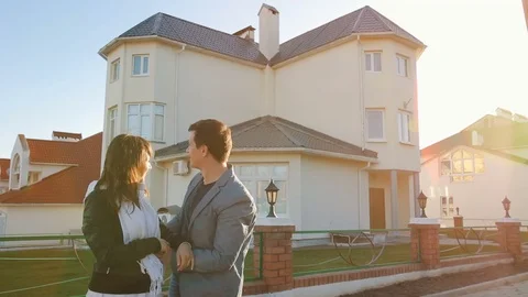 Couple in front of new house Video stock 75276862