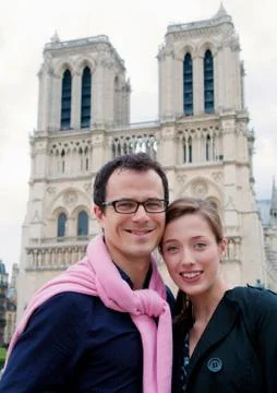 Couple in front of Notre Dame Paris Stock Photos