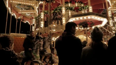A couple in front of a Traditional carousel Stock Footage 70809118
