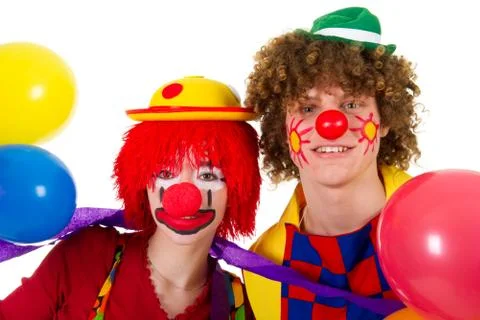 Couple funny clowns with balloons Stock Photos