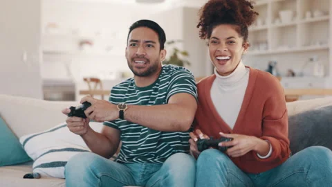 Couple, gaming and sofa with controller,... | Stock Video | Pond5