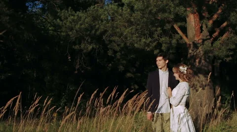 Couple Gently Hugging in a Field of Wheat Stock Footage 62349208