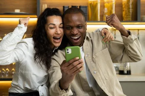 Couple gets happy after checking results of competition Stock Photos