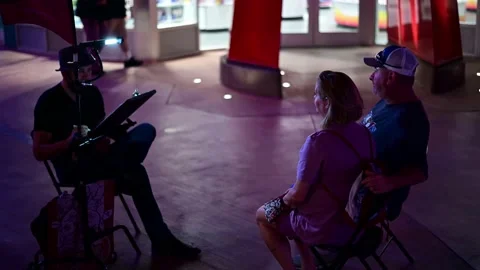 Couple Getting Caricature Stock-Footage 137278043