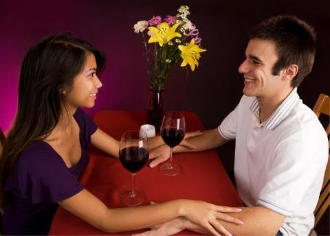 Couple getting closer while having wine Stock Photos