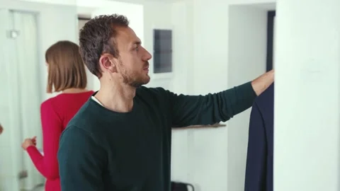 Couple getting ready with mask look at mirror and go from home safety Stock Footage 132538919