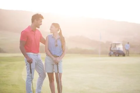 Couple on golf course Fotos de archivo