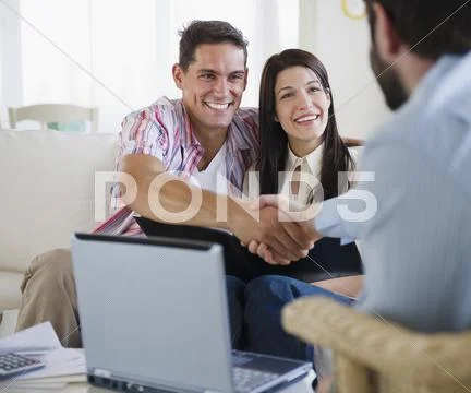Couple Greeting Finance Advisor