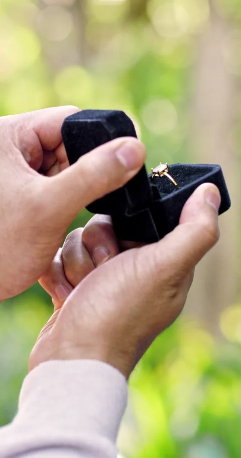 Couple, hands and ring box for proposal, love and engagement together with Stock Footage 336695547
