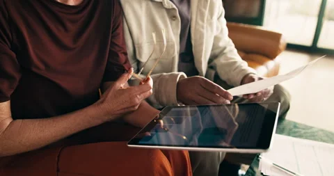 Couple, hands and tablet in home with document, data analysis and risk Stock Footage 338115238