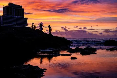 Couple by hands at the Beach at Sunset Stock Photos