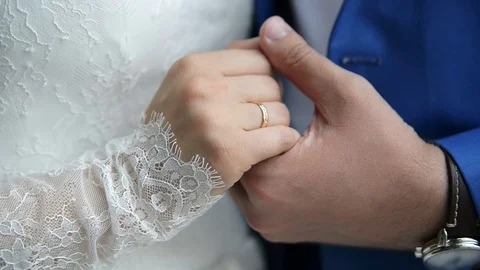 Couple hands embracing on wedding day Stock Footage 71295033
