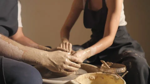 Couple hands making clay jug Stock Footage 102247938