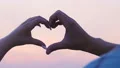 Couple hands making heart sign sky background, love symbol, romantic relations HD Footage