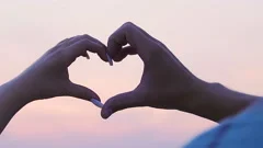 Couple hands making heart sign sky backg... | Stock Video | Pond5
