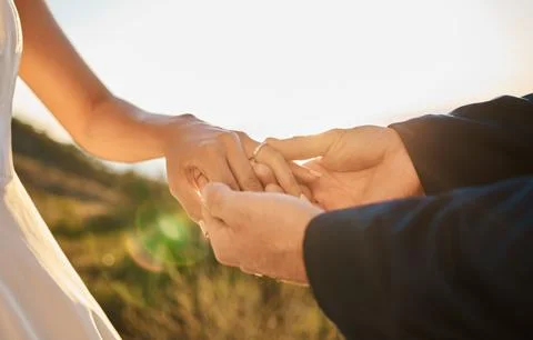 Couple hands, wedding ring and marriage trust, hope and love together in nature Stock Photos