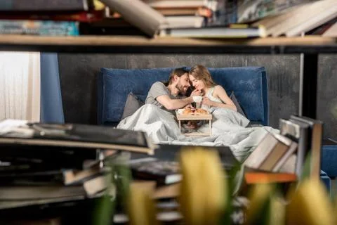 Couple has breakfast in bed Stock Photos