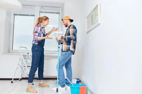 Couple has different points of view about home repair but try to make joke of it Stock Photos