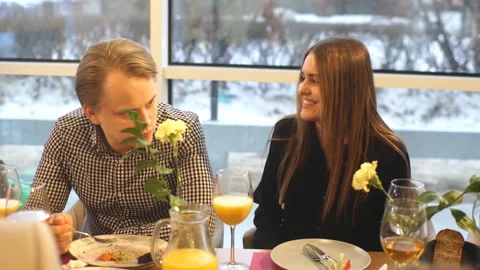 A couple has dinner in the restaurant and laughs Stock Footage 87972846